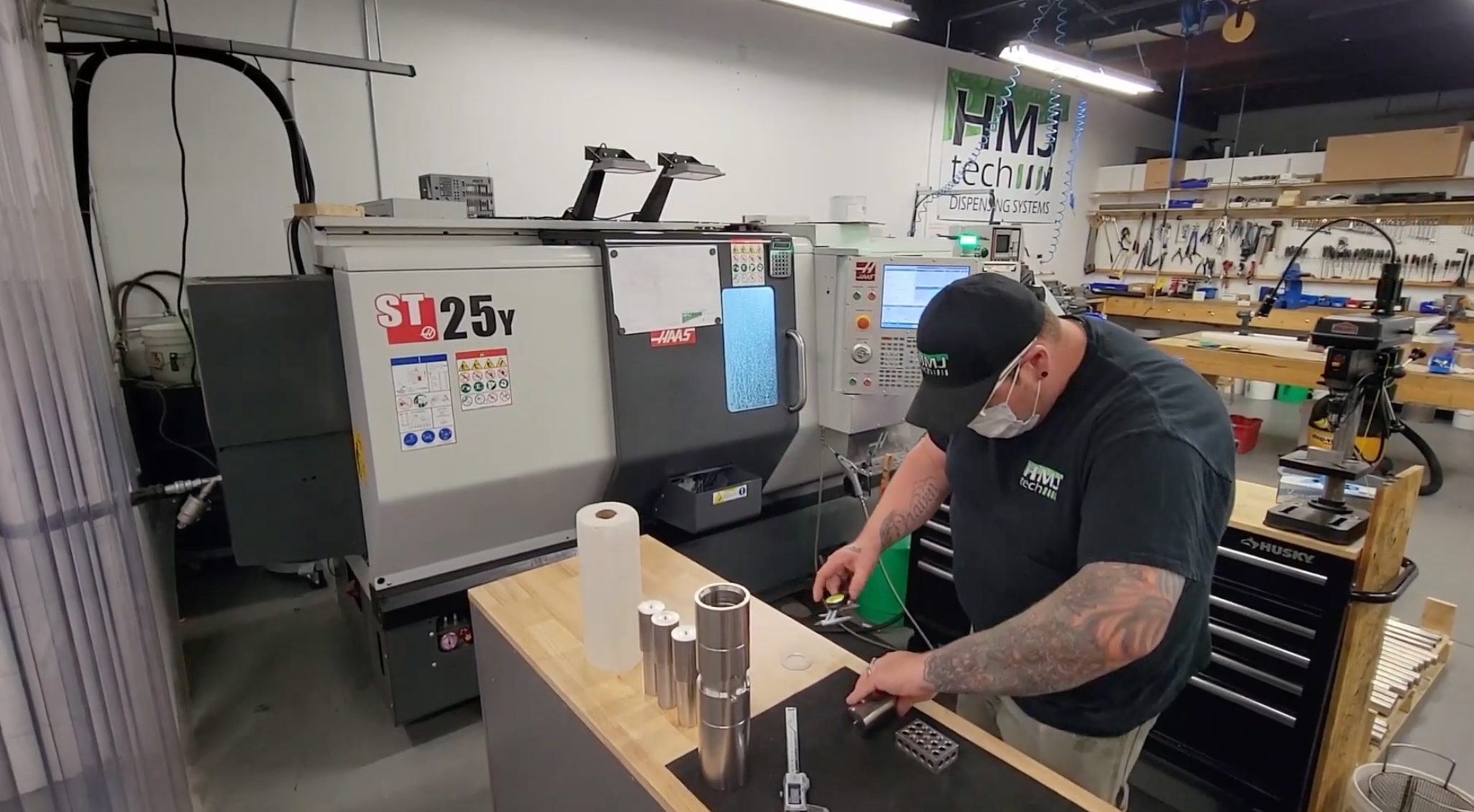 HMJ tech team member working on building parts for HMJ tech dispensers